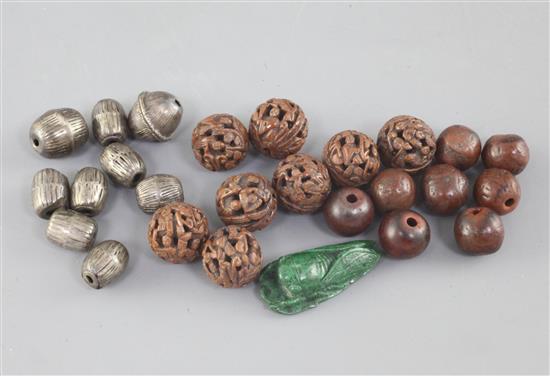 A collection of Chinese kernel and silver beads, late Qing dynasty,